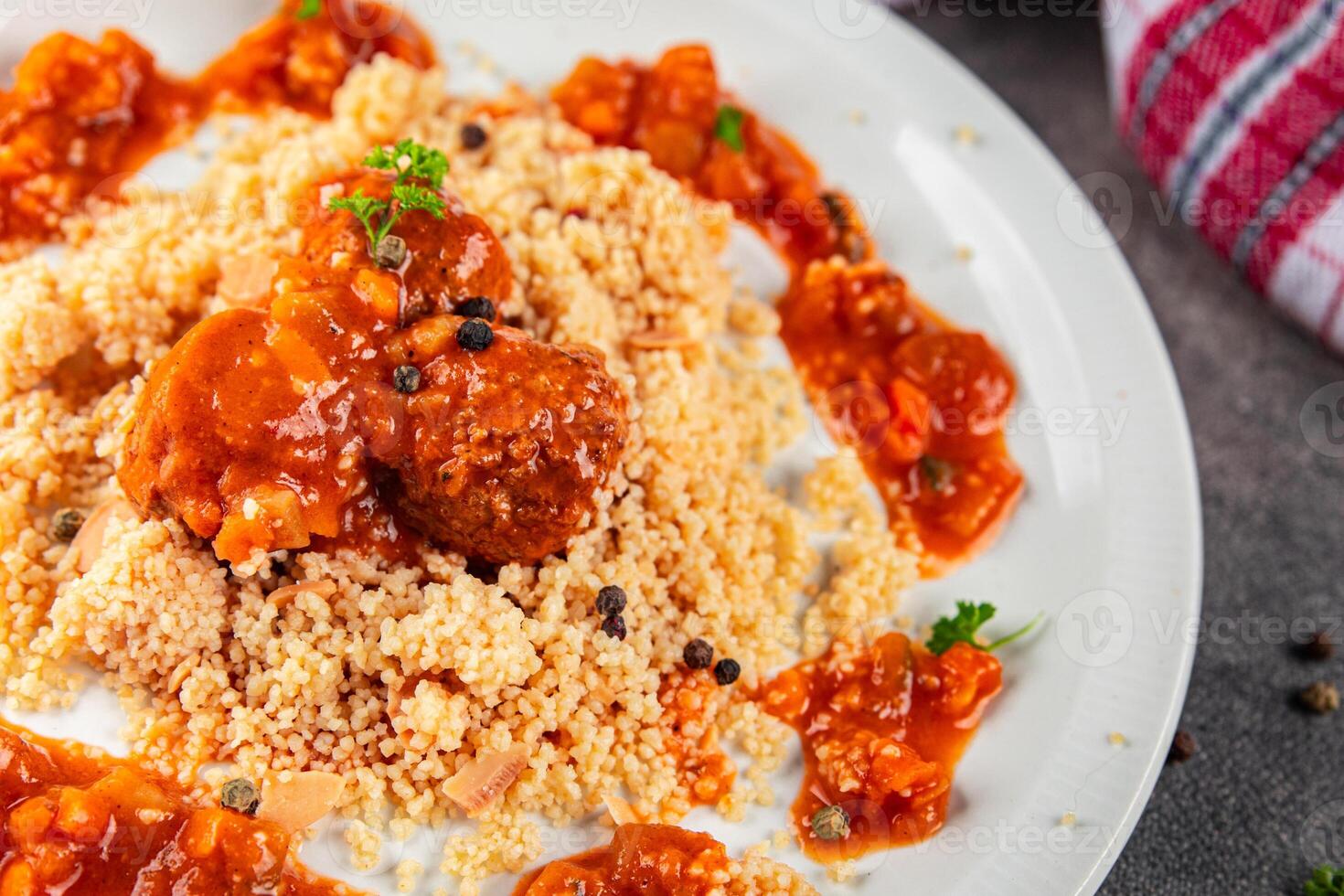 couscous with meat balls vegetable sauce tasty fresh meal food snack on the table copy space food background rustic top view keto or paleo diet photo