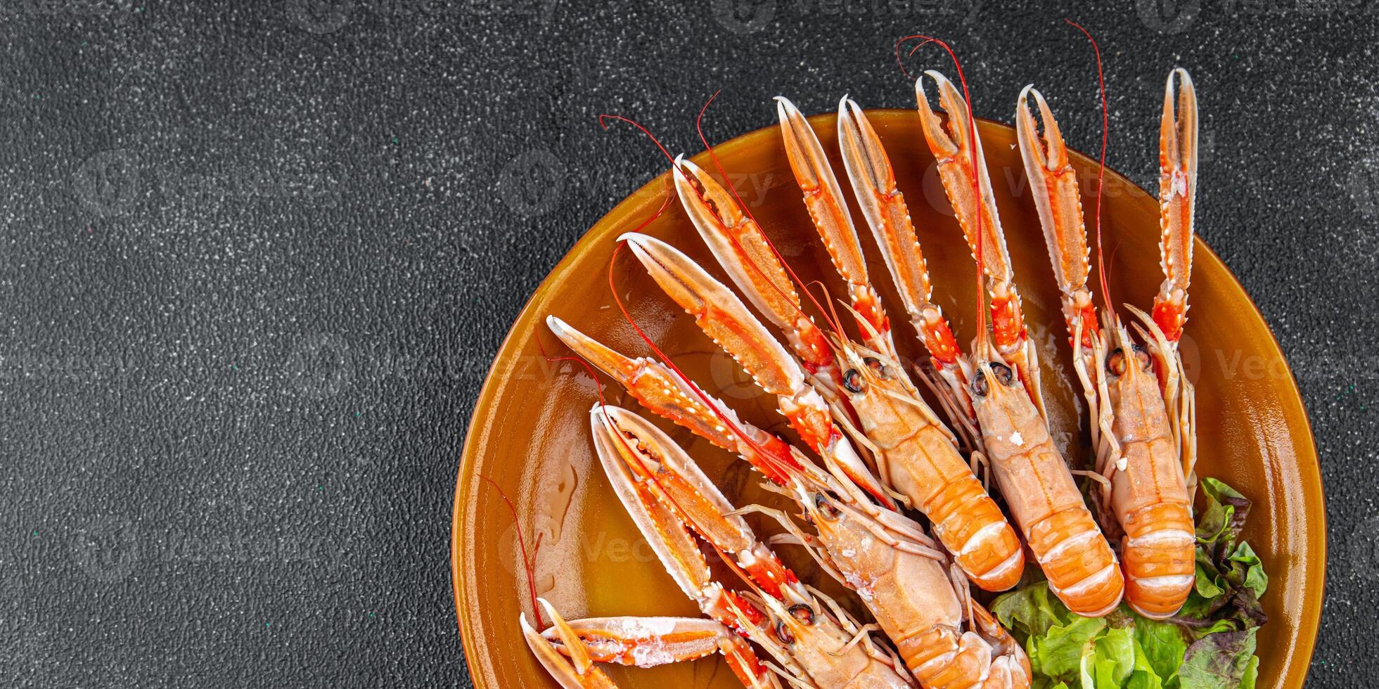 langoustine tasty seafood shrimp prawns delicious fresh meal food snack on the table copy space food background rustic top view keto or paleo diet Pescetarian photo