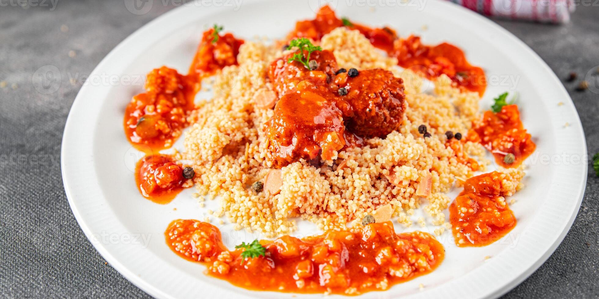couscous with meat balls vegetable sauce tasty fresh meal food snack on the table copy space food background rustic top view keto or paleo diet photo