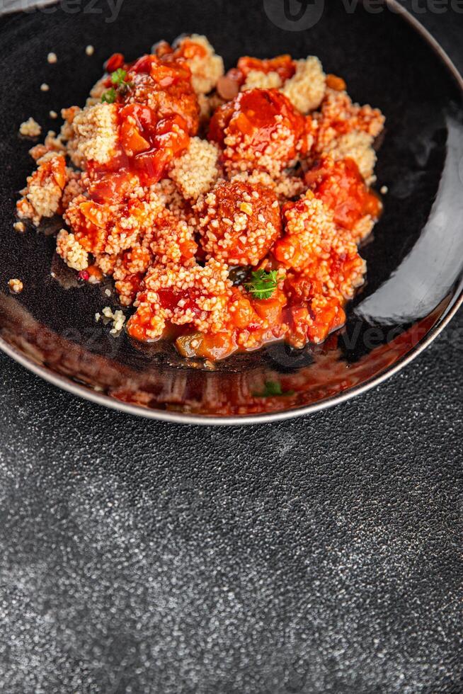 couscous with meat balls vegetable sauce tasty fresh meal food snack on the table copy space food background rustic top view keto or paleo diet photo