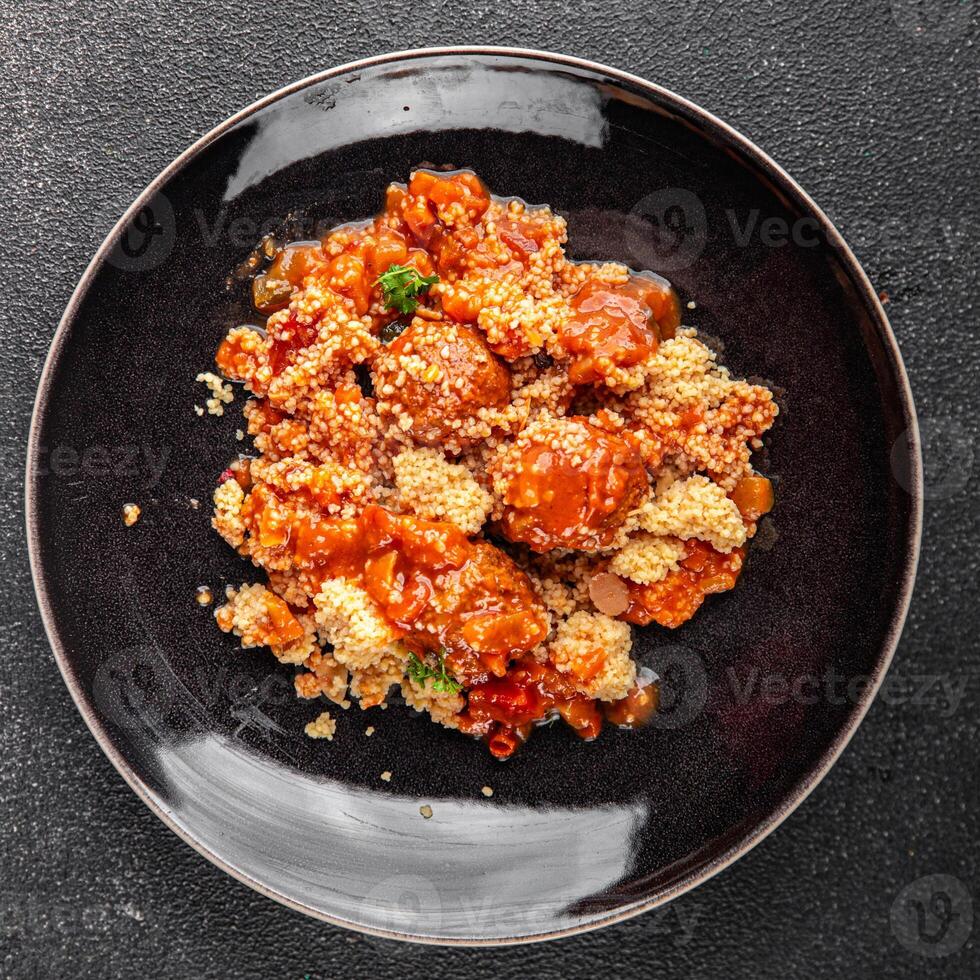 couscous food meat balls vegetable sauce tasty fresh meal snack on the table copy space food background rustic top view photo