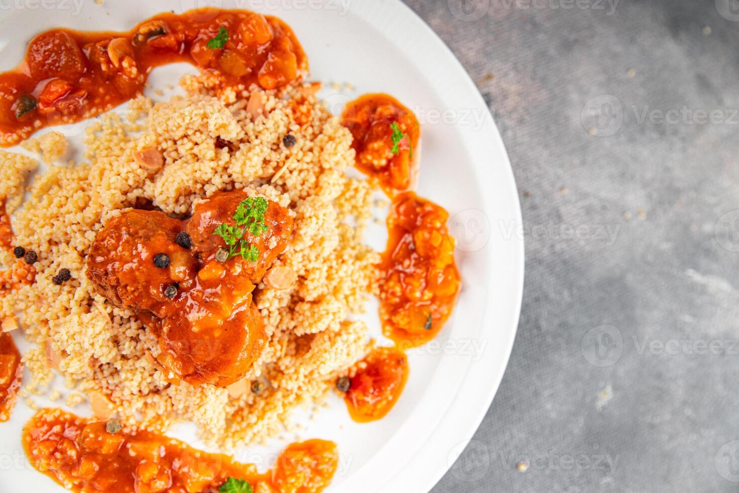 couscous with meat balls vegetable sauce tasty fresh meal food snack on the table copy space food background rustic top view keto or paleo diet photo