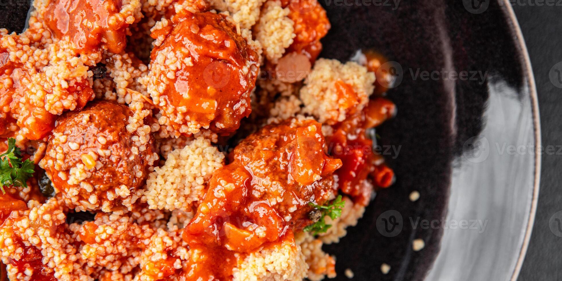 couscous with meat balls vegetable sauce tasty fresh meal food snack on the table copy space food background rustic top view keto or paleo diet photo