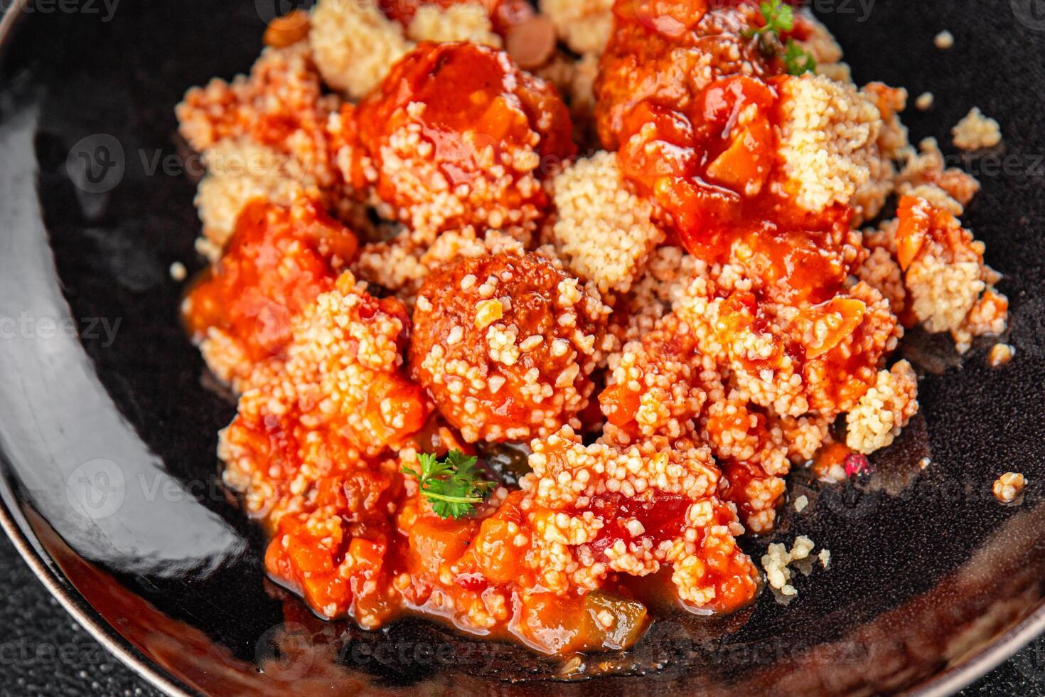 couscous with meat balls vegetable sauce tasty fresh meal food snack on the table copy space food background rustic top view keto or paleo diet photo