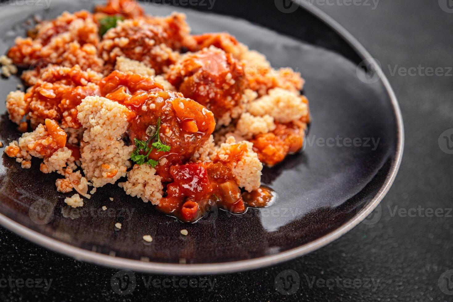 couscous with meat balls vegetable sauce tasty fresh meal food snack on the table copy space food background rustic top view keto or paleo diet photo