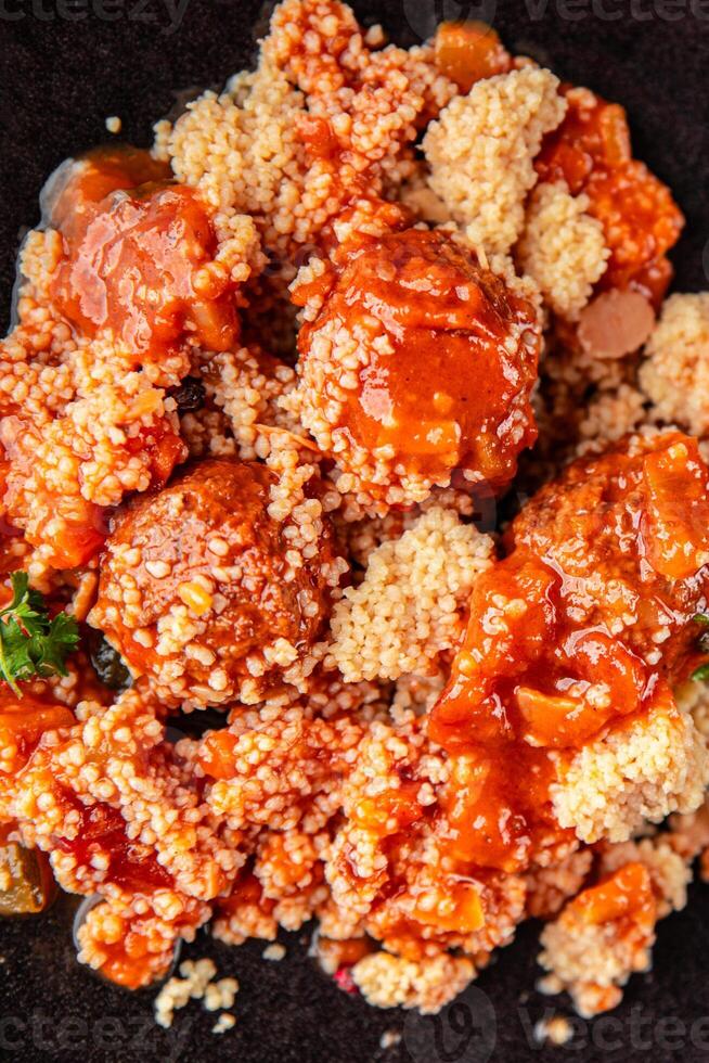 couscous food meat balls vegetable sauce tasty fresh meal snack on the table copy space food background rustic top view photo