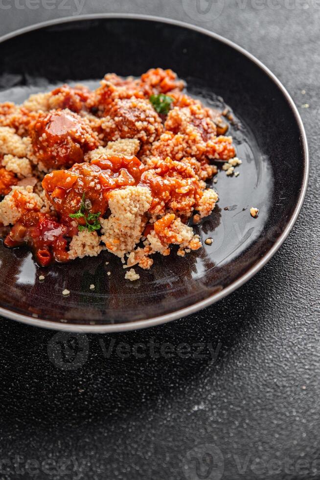 couscous with meat balls vegetable sauce tasty fresh meal food snack on the table copy space food background rustic top view keto or paleo diet photo