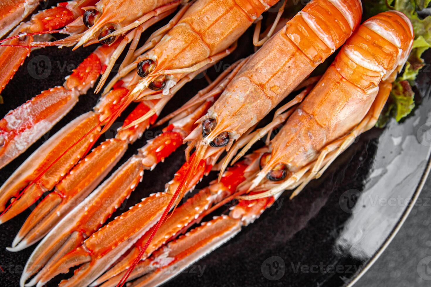 langoustine tasty seafood shrimp prawns delicious fresh meal food snack on the table copy space food background rustic top view keto or paleo diet Pescetarian photo