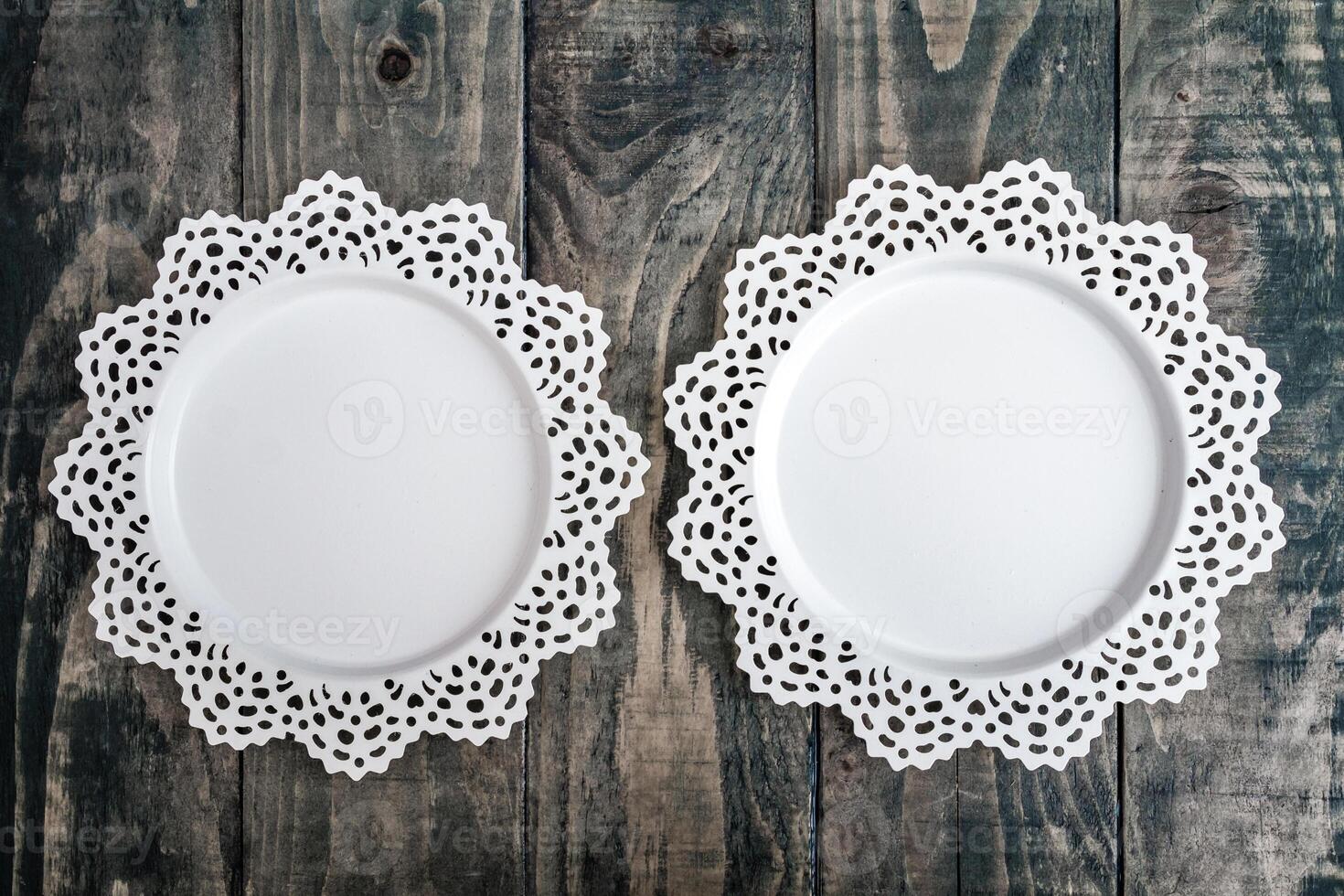 Decorative White Metal Trays on a Dark Wooden Background photo