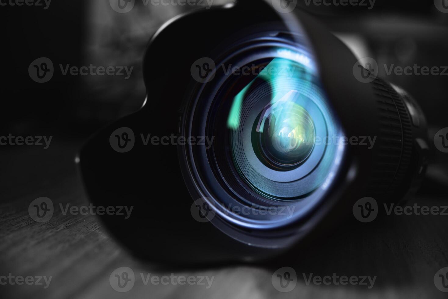 close-up of an optical lens lying on a table photo