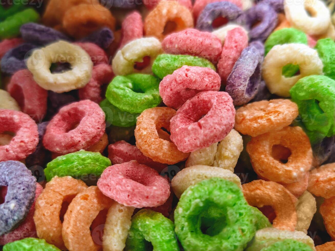 Colorful fruit corn cereal rings. Highly detailed macro close up shot of this nutritious and delicious breakfast and snack favorite. photo