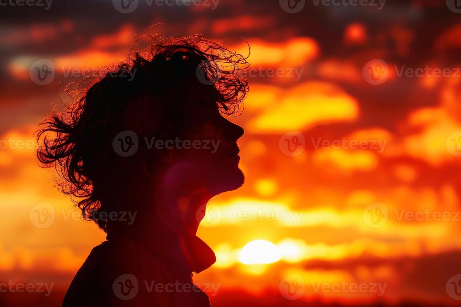 A person in profile standing against a vibrant sunset backdrop creating a golden silhouette. AI generate photo