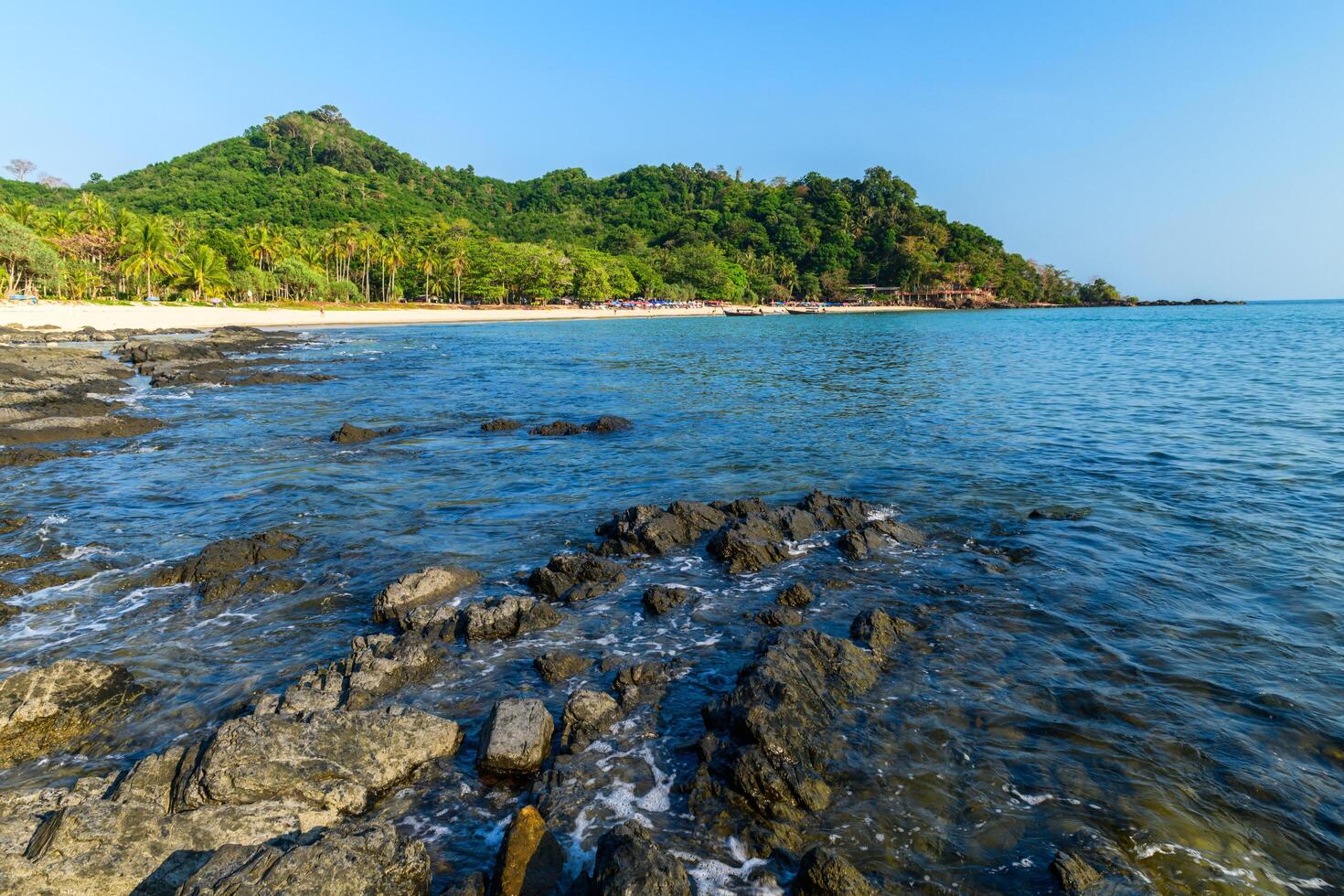 landscape of Farang Beach or Charlie Beach, there are many rock on the sandy beach photo