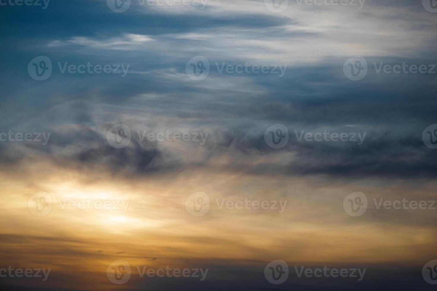 Sunset sky. Abstract nature background. Dramatic blue and orange, colorful clouds at twilight time photo