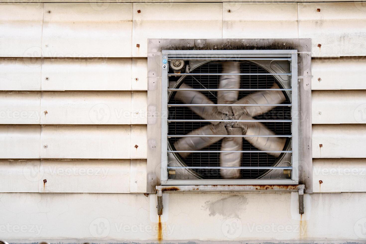 Six-blade exhaust fan. A grunge fan on the wall. photo
