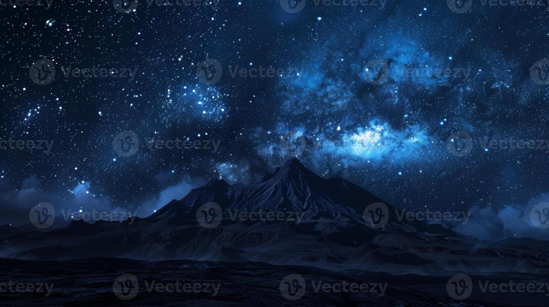 A breathtaking nocturnal scene featuring the Milky Way's radiant glow over a rugged, snow-capped mountain range under a star-filled sky. photo