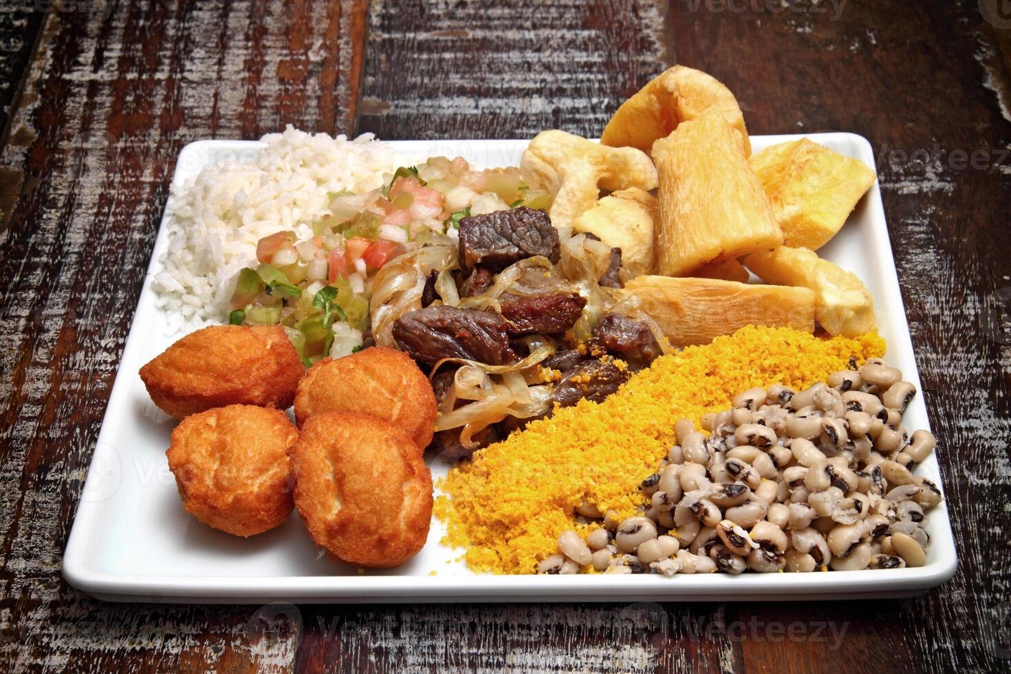 Bahian dish with acaraje, abara, caruru and vinaigrette sauce photo