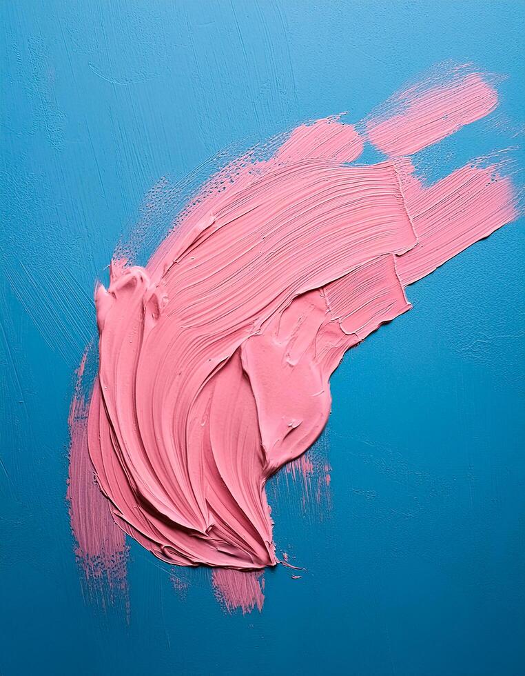 Abstract pink oil paint texture on blue canvas or wall. Minimalistic background with copy space. photo