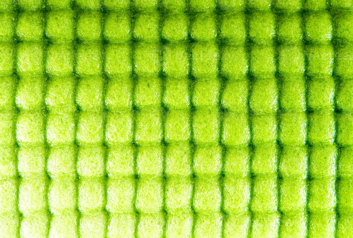 Surface texture of Yoga mat, green sponge mat photo