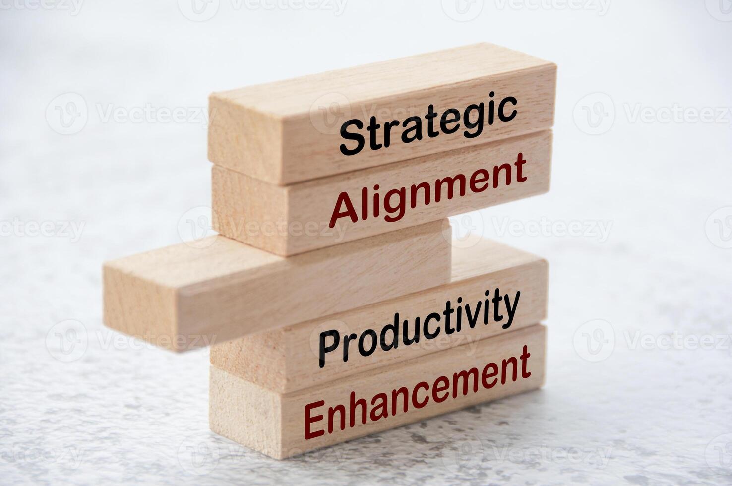 Strategic alignment and productivity enhancement text on wooden blocks. Operational excellence concept photo