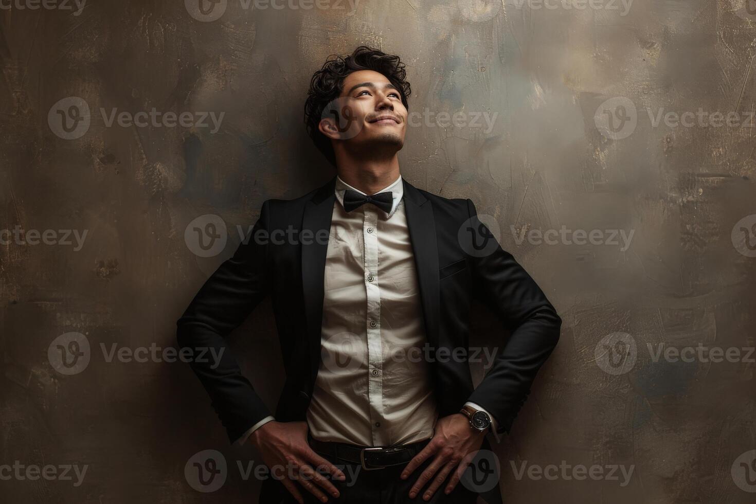 Man in tuxedo posing for picture photo