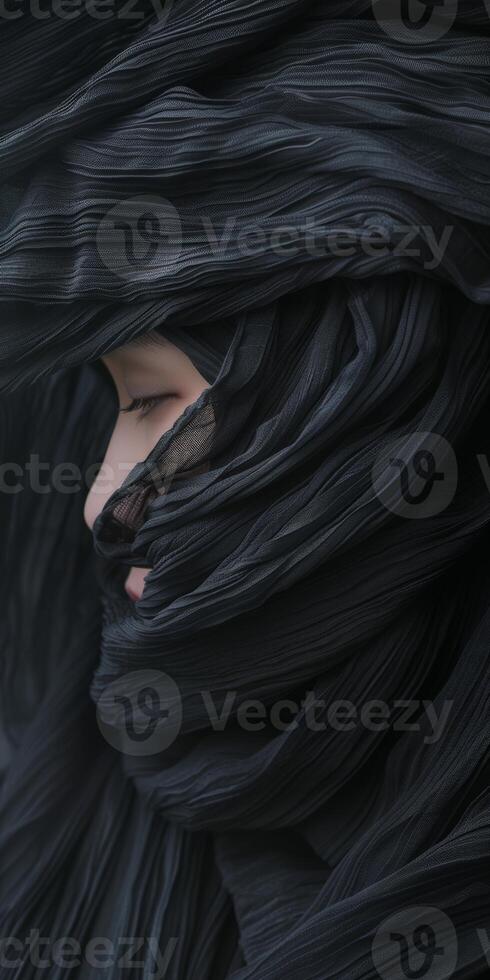 Close up of person with black hair photo