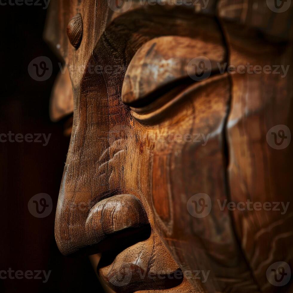 Close Up of Wooden Carving of a Persons Face photo