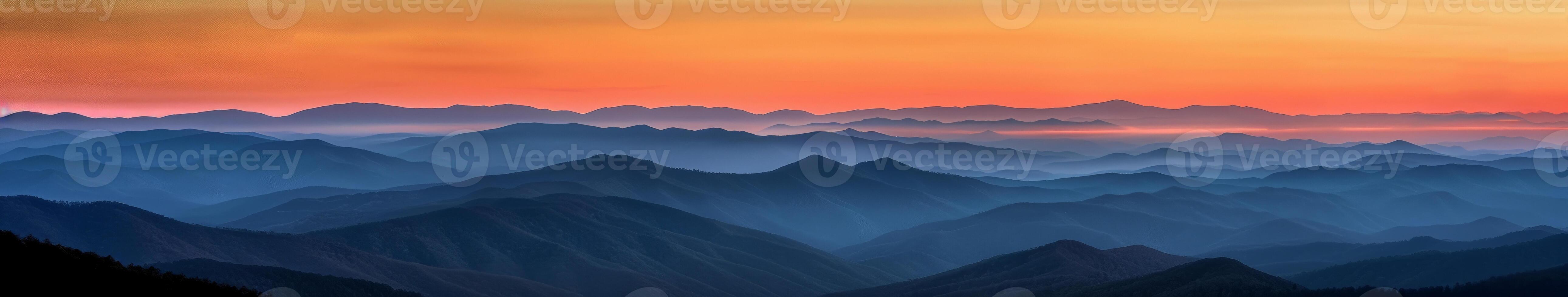 Majestic Mountain Range Illuminated by Sunset photo