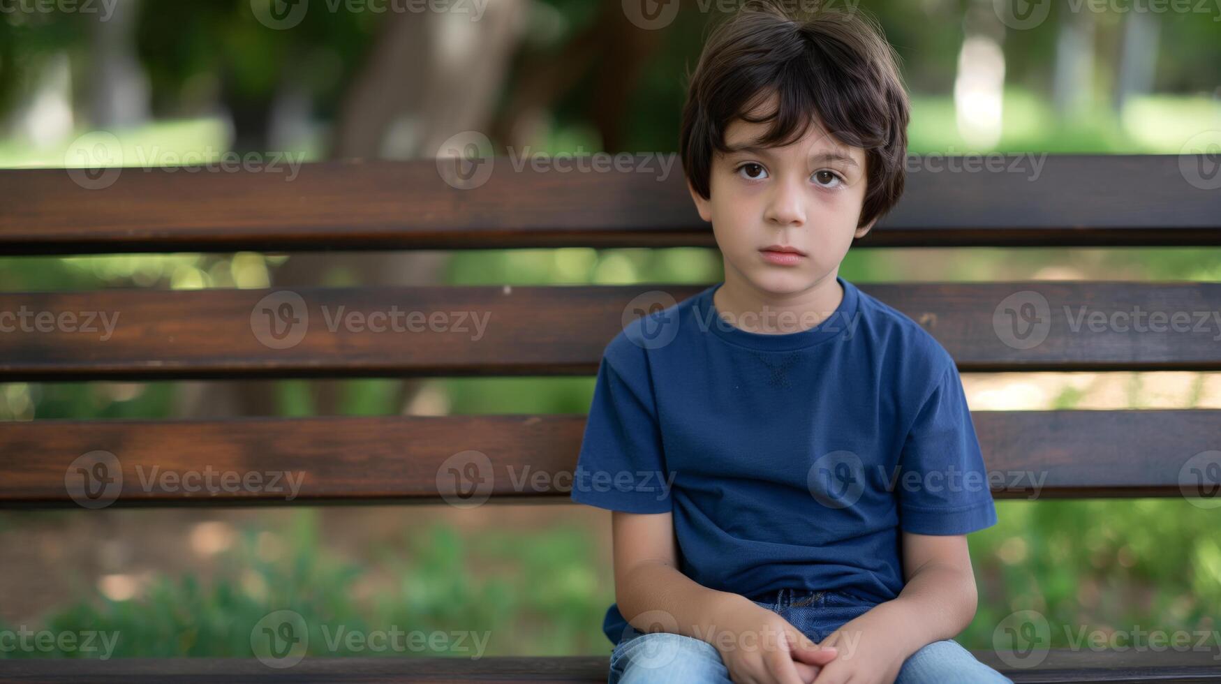 Thoughtful Young Greek Boy Sitting on Park Bench in Summer, Ideal for Editorial Use or Website Design photo