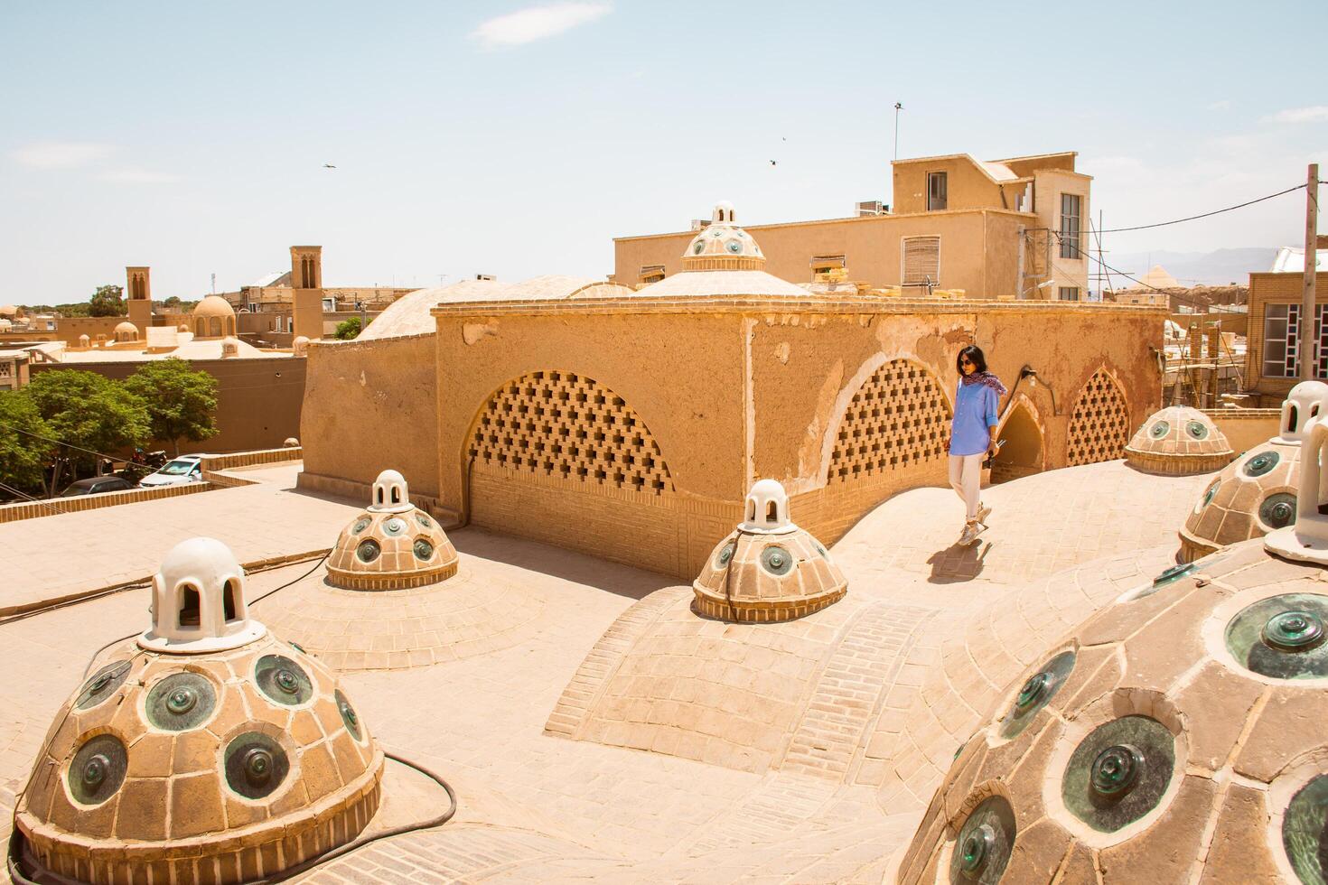 Kashan, Iran - 29th june, 2022 - Muslim tourist visit Sultan Amir Ahmad Bathhouse. Group of tourist visit famous bathhouse in Kashan with tout Guide explain photo