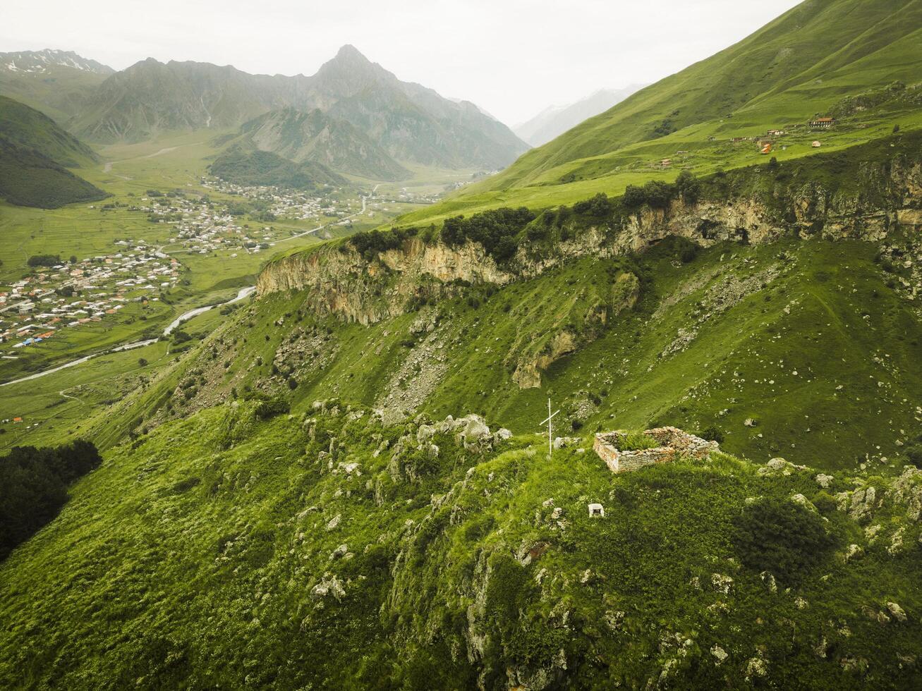 Ascending view Hidden gem - Arsha fortress built in XVI century - defense fortress in medieval Khevi. Things to see. KAzbegi national park. Sightseeing Georgia historical landmarks photo