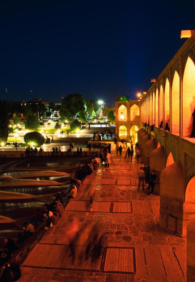 Isfahan, Iran - 15th june, 2022 - Old Khajoo bridge at night, across the Zayandeh River in Isfahan, Iran. photo