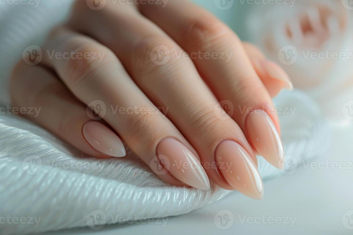 Girl's hands with a beautiful art manicure design nails extension procedure in a beauty salon photo