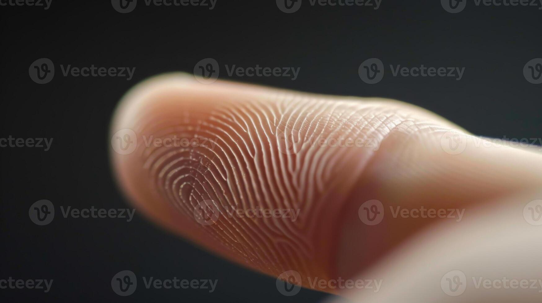Finger with friction ridges on dark background, macro view photo
