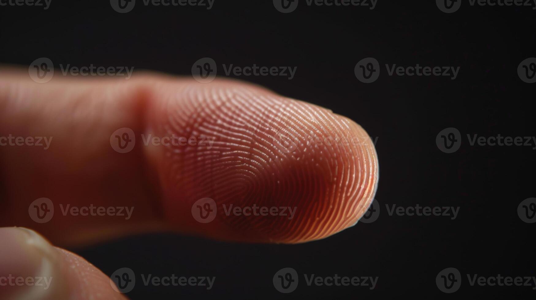 Finger with friction ridges on dark background, macro view photo