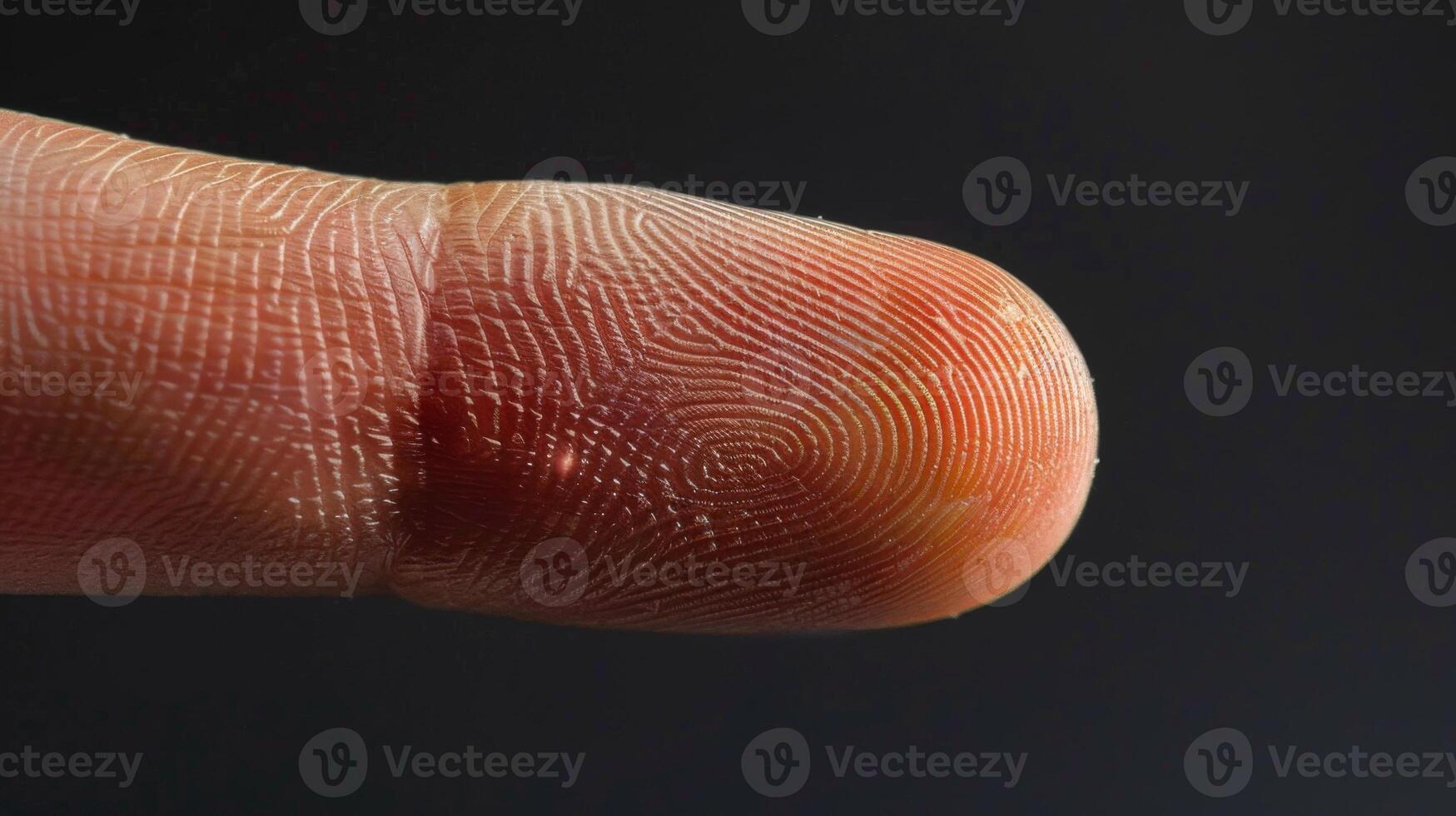 Finger with friction ridges on dark background, macro view photo