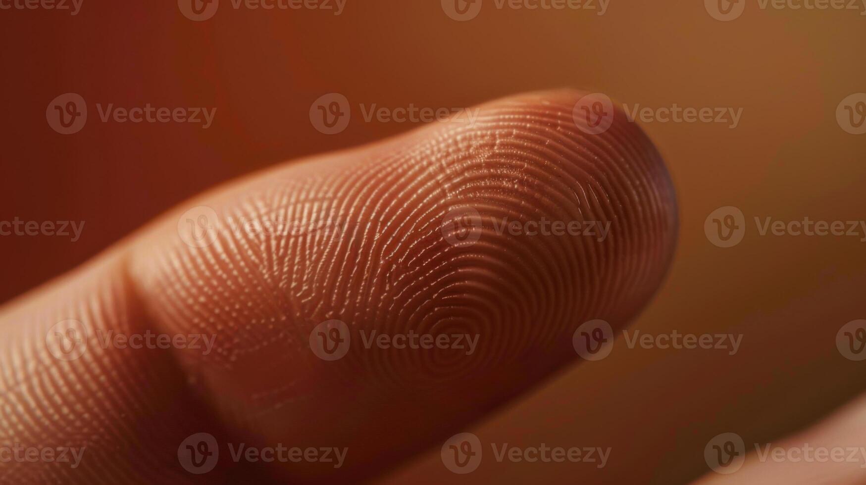 Finger with friction ridges on dark background, macro view photo