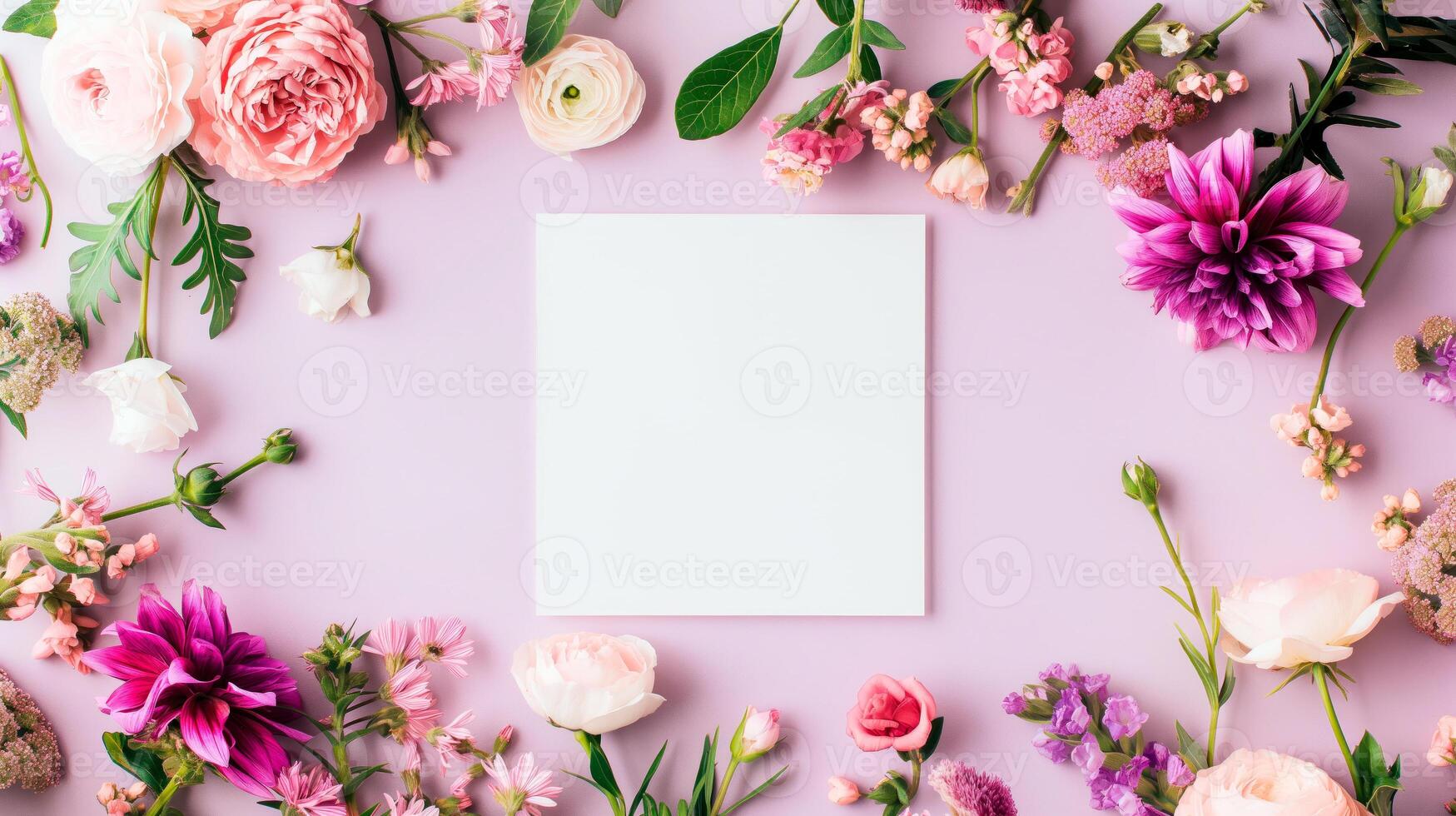 Flat lay of beautiful flowers over pink background and blank card for invitation. Mother's day, Valentine's day or wedding concept. Mock up template with space for text or product. photo