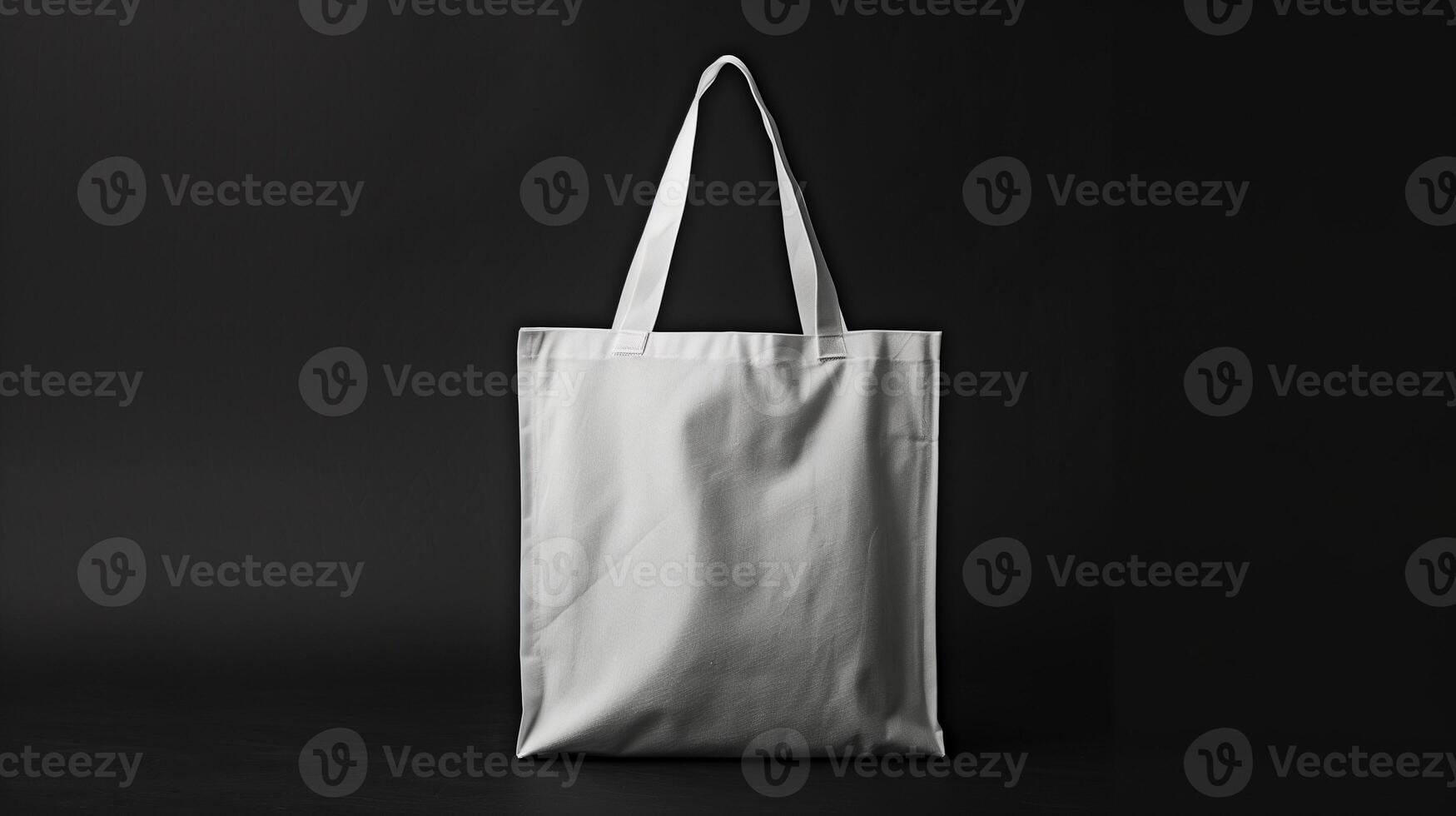 Plain white tote bag mockup against stark black background. Minimalistic simplicity. Recycled blank bag template advertising image. Classic totebag mock up product photorealistic photo