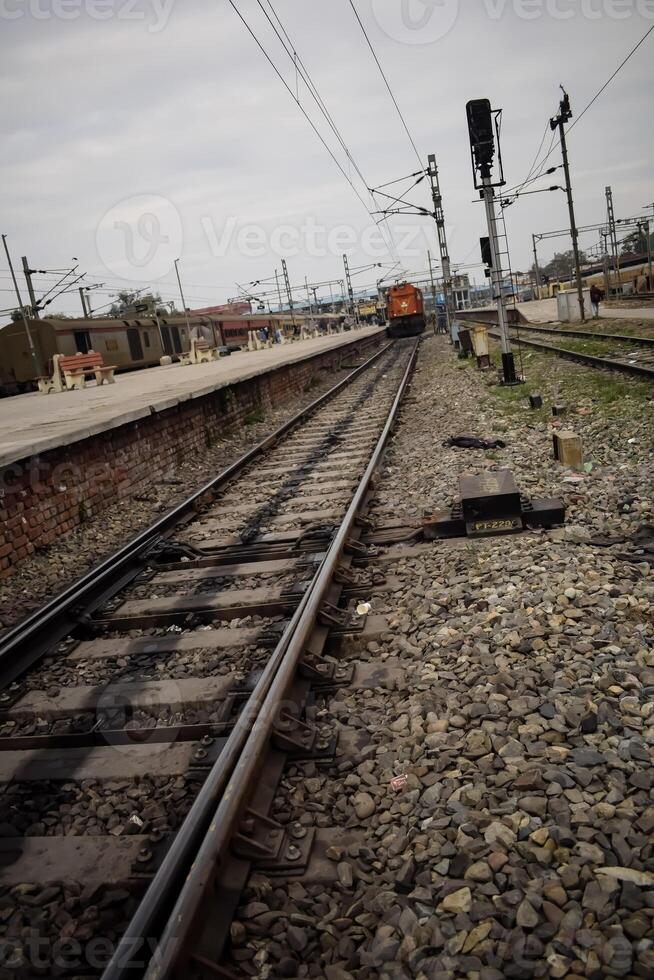View of train Railway Tracks from the middle during daytime at Kathgodam railway station in India, Train railway track view, Indian Railway junction, Heavy industry photo