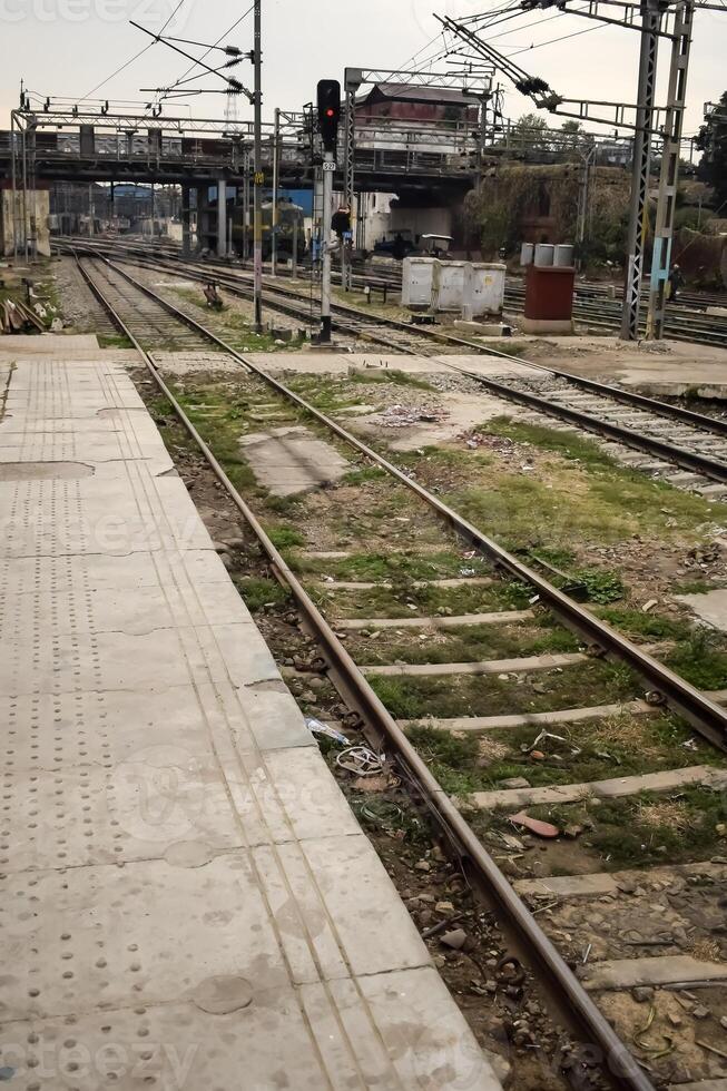 View of train Railway Tracks from the middle during daytime at Kathgodam railway station in India, Train railway track view, Indian Railway junction, Heavy industry photo