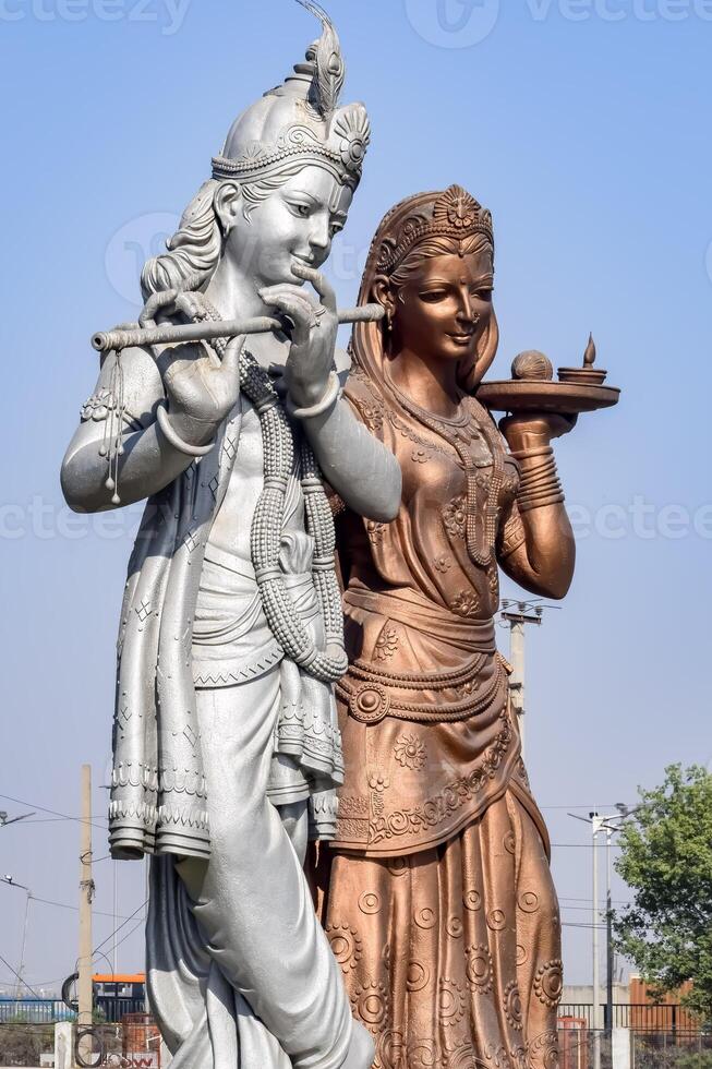 Big statue of Lord Radha Krishna near Delhi International airport, Delhi, India, Lord Krishna and Radha big statue touching sky at main highway Mahipalpur, Delhi photo