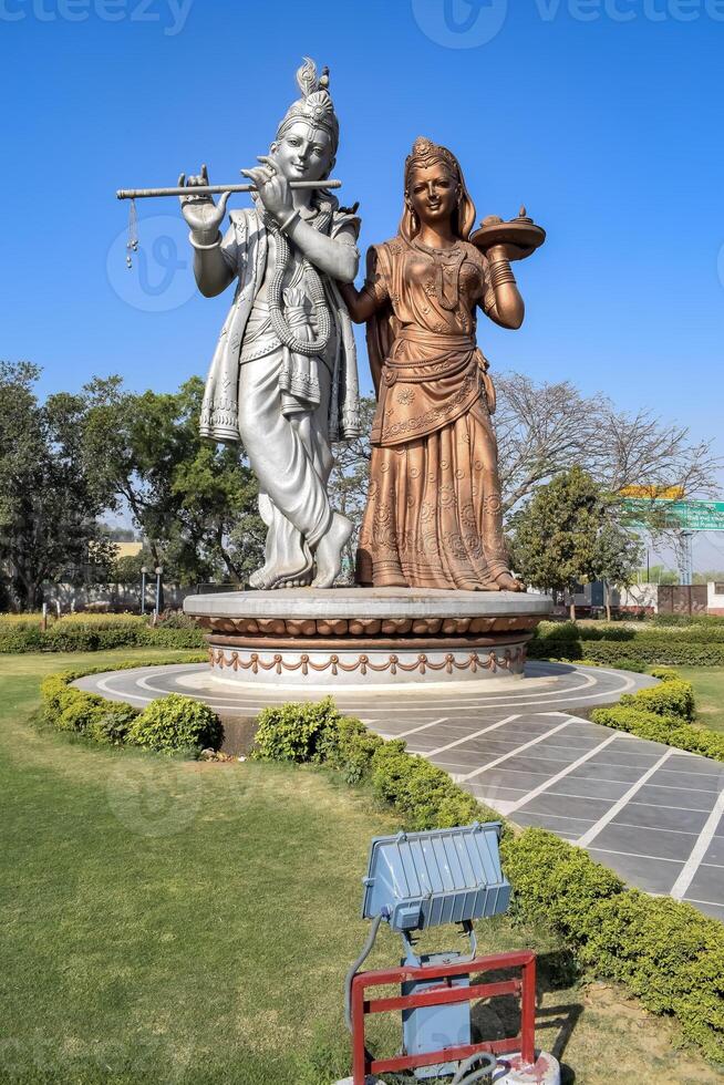 Big statue of Lord Radha Krishna near Delhi International airport, Delhi, India, Lord Krishna and Radha big statue touching sky at main highway Mahipalpur, Delhi photo
