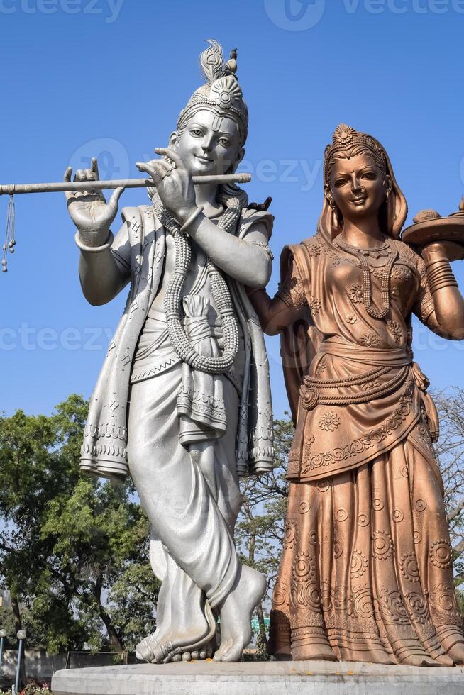 Big statue of Lord Radha Krishna near Delhi International airport, Delhi, India, Lord Krishna and Radha big statue touching sky at main highway Mahipalpur, Delhi photo