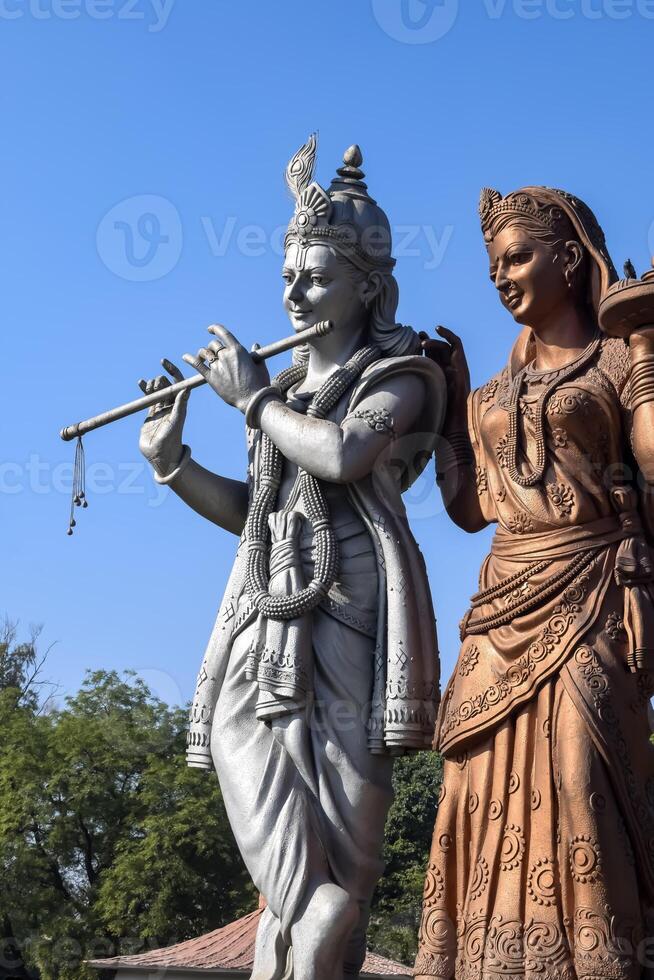 Big statue of Lord Radha Krishna near Delhi International airport, Delhi, India, Lord Krishna and Radha big statue touching sky at main highway Mahipalpur, Delhi photo