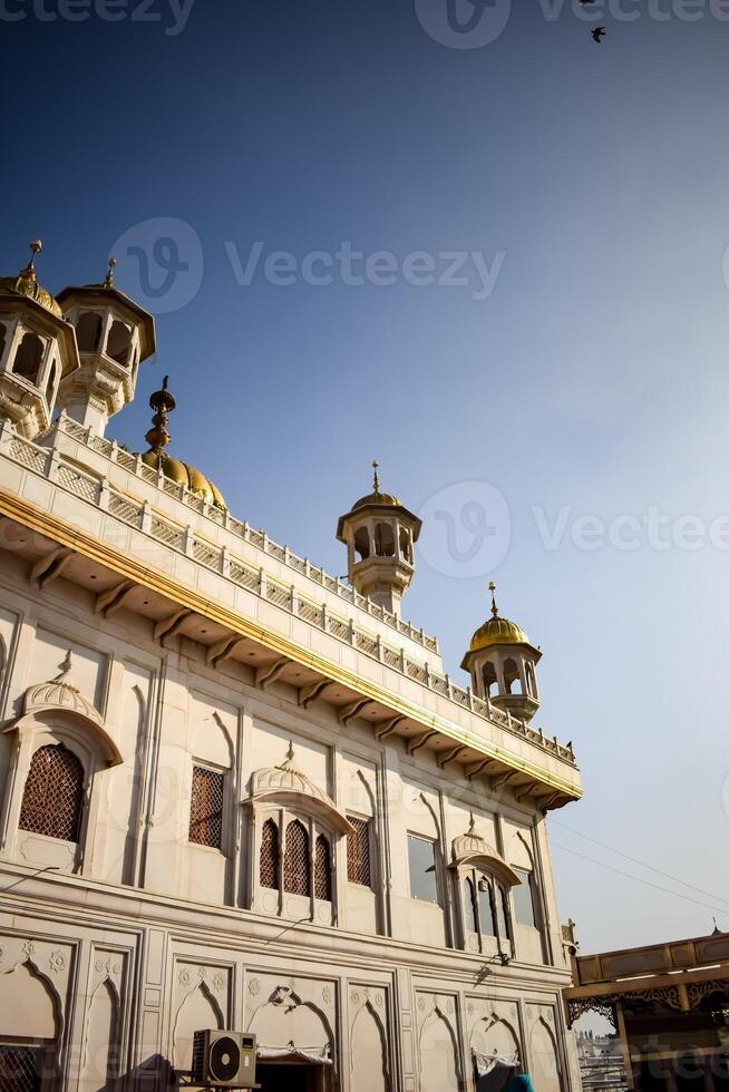 View of details of architecture inside Golden Temple - Harmandir Sahib in Amritsar, Punjab, India, Famous indian sikh landmark, Golden Temple, the main sanctuary of Sikhs in Amritsar, India photo
