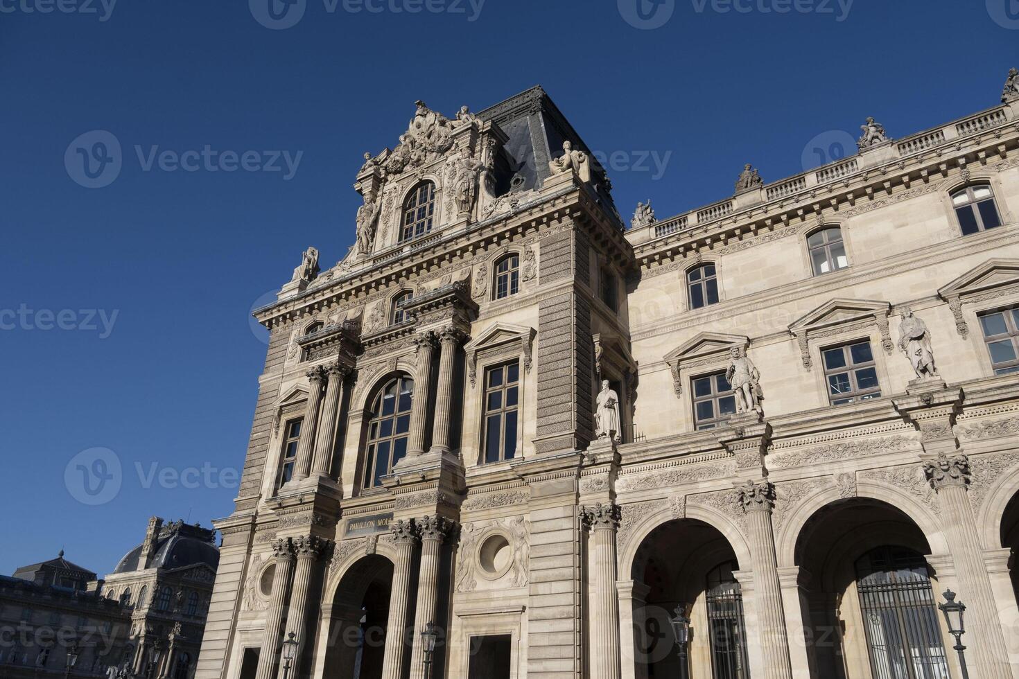 view of the city of light during the day on a blue sky day with its typical architecture photo