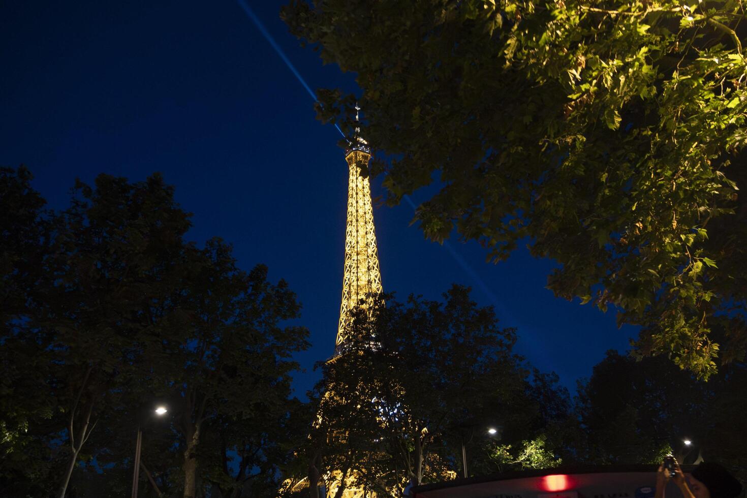 Paris at night with Eiffel Tower illuminated photo