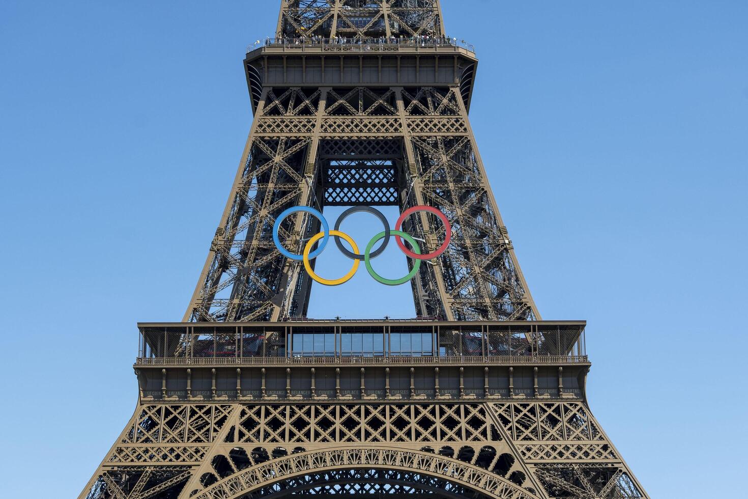 Eiffel Tower with Olympic rings to mark the games taking place in the city photo