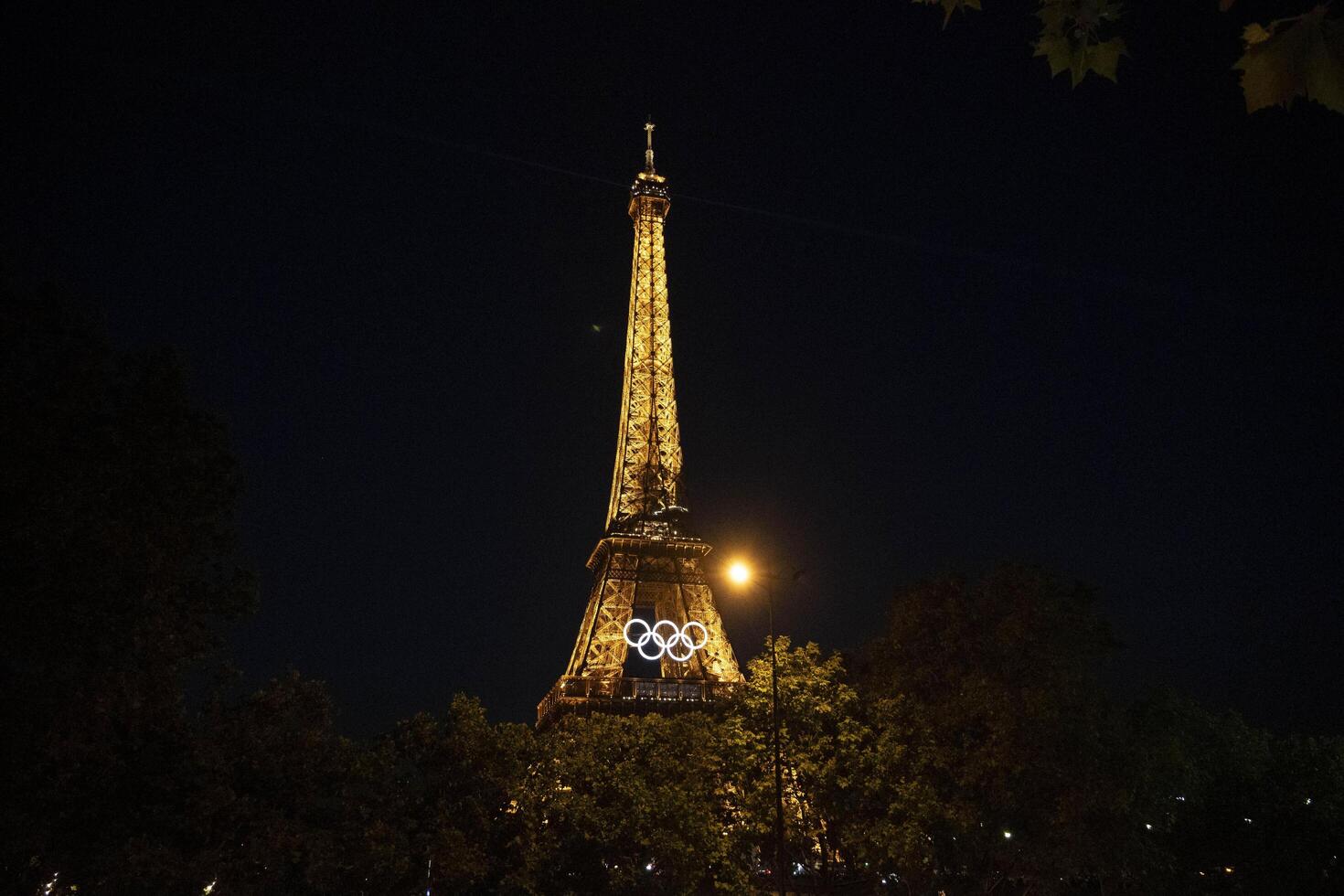 Eiffel Tower with Olympic rings to mark the games taking place in the city photo